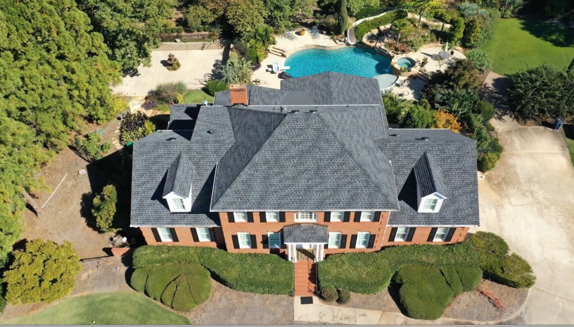 Roofing company team receiving an industry award for quality service.