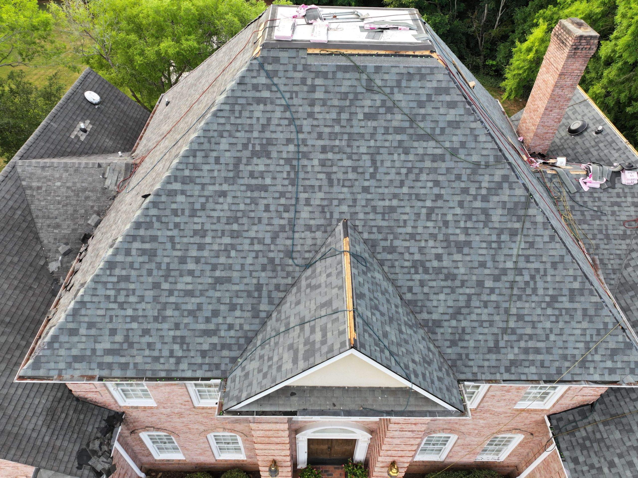 Roofing company team receiving an industry award for quality service.